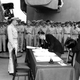 Japanese Foreign Minister Mamoru Shigemitsu signs the Instrument of Surrender on behalf of the Japanese Government, formally ending World War II